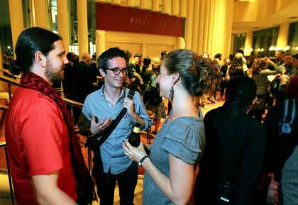 Pop-UP Magazine Editor-in-Chief Douglas McGray center, chats with Theo Rigby and Katina Papson-Rigby at a reception following the performance. Thousands attended the sixth annual Pop-Up Magazine live event at Davies Symphony Hall Wednesday, April 25, 2012 in San Francisco, Calif. Contributors presented stories and ideas around science, music, politics, art, business, food, literature, and design in an event that sold out in 15 minutes.