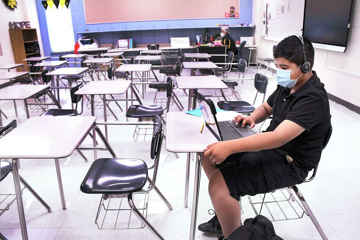 Salvador Garcia Middle School 6th grade student Jose Criado Lozano uses his Chromebook to work on a classroom assignment, Monday, August 24, 2020, as United ISD began their 2020-2021 school year. Lozano was the only student to attend the school instead of using virtual technology. UISD voted to go to remote learning for the week of Jan. 17 through Jan. 21 on Thursday.
