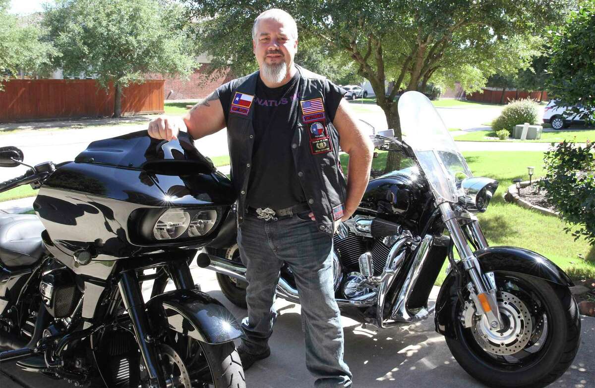 Thomas Kost polishes his motorcycles in the driveway of his home in Pflugerville on Sept. 29, 2020.