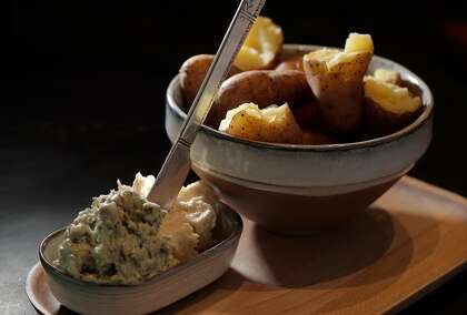 Potatoes are served with heaps of butter at the Anchovy Bar in San Francisco.