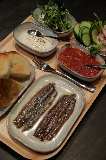 Diners are encouraged to make their own anchovy toasts at San Francisco’s Anchovy Bar.