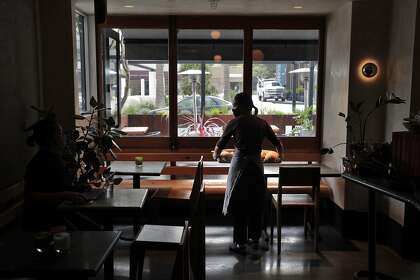 Pastry chef Kat Kwuan brings in freshly made bread to the Anchovy Bar in San Francisco. The new restaurant opened Thursday.