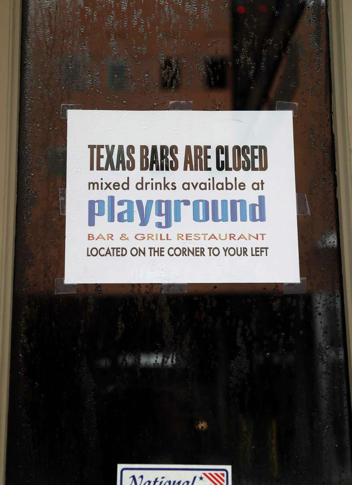 A sign telling customers it is closed on the door of the Bliss Lounge on The Strand, Friday, June 26, 2020, in Galveston. After the Governor ordered all bars closed due to the increased numbers of people testing for Covid-19.