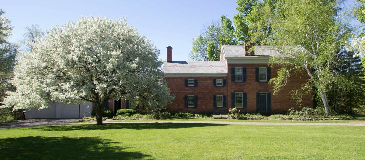 An 1840s brick Greek Revival in the Rensselaer countryside. Five bedrooms, three bathrooms, 3,917 square feet of living space. 65 acres, barns & pond. Taxes: Approximately $18,000. List price: $980,000. Contact listing agent Harold Reiser at Julie & Co Realty at 518-588-5224.