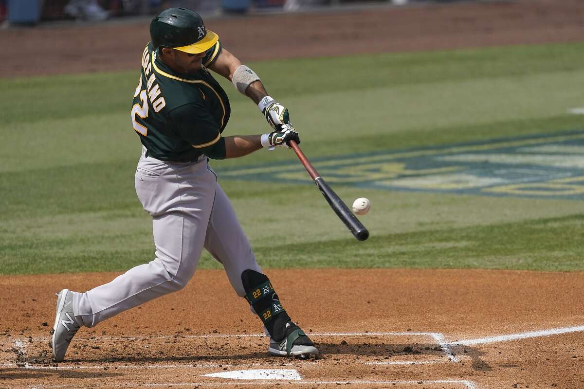 Oakland Athletics' Ramon Laureano hits a three-run home run against the Houston Astros during the second inning of Game 4 of a baseball American League Division Series in Los Angeles, Thursday, Oct. 8, 2020. (AP Photo/Ashley Landis)