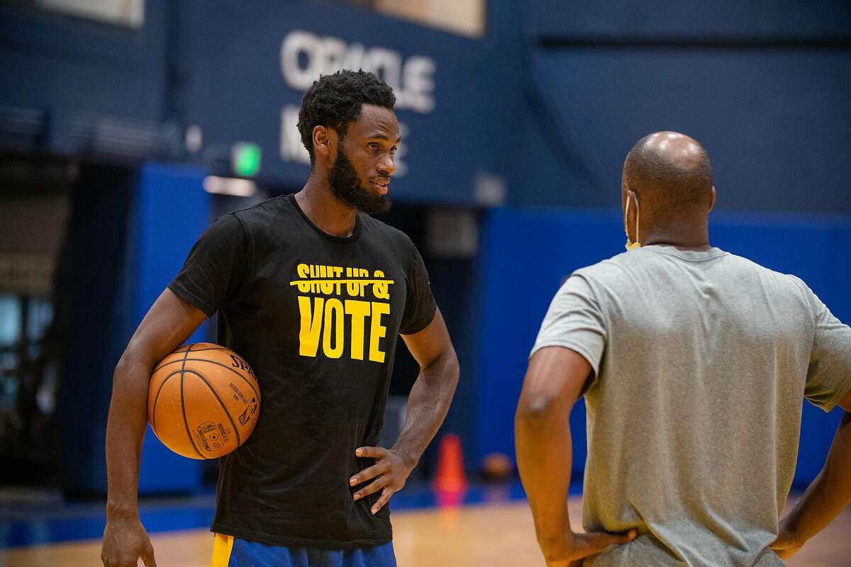 Forward Roger Moute a Bidias (left), here with Santa Cruz Warriors head coach Kris Weems, was largely a reserve player at Cal, but now he’s getting a shot at making an NBA roster.