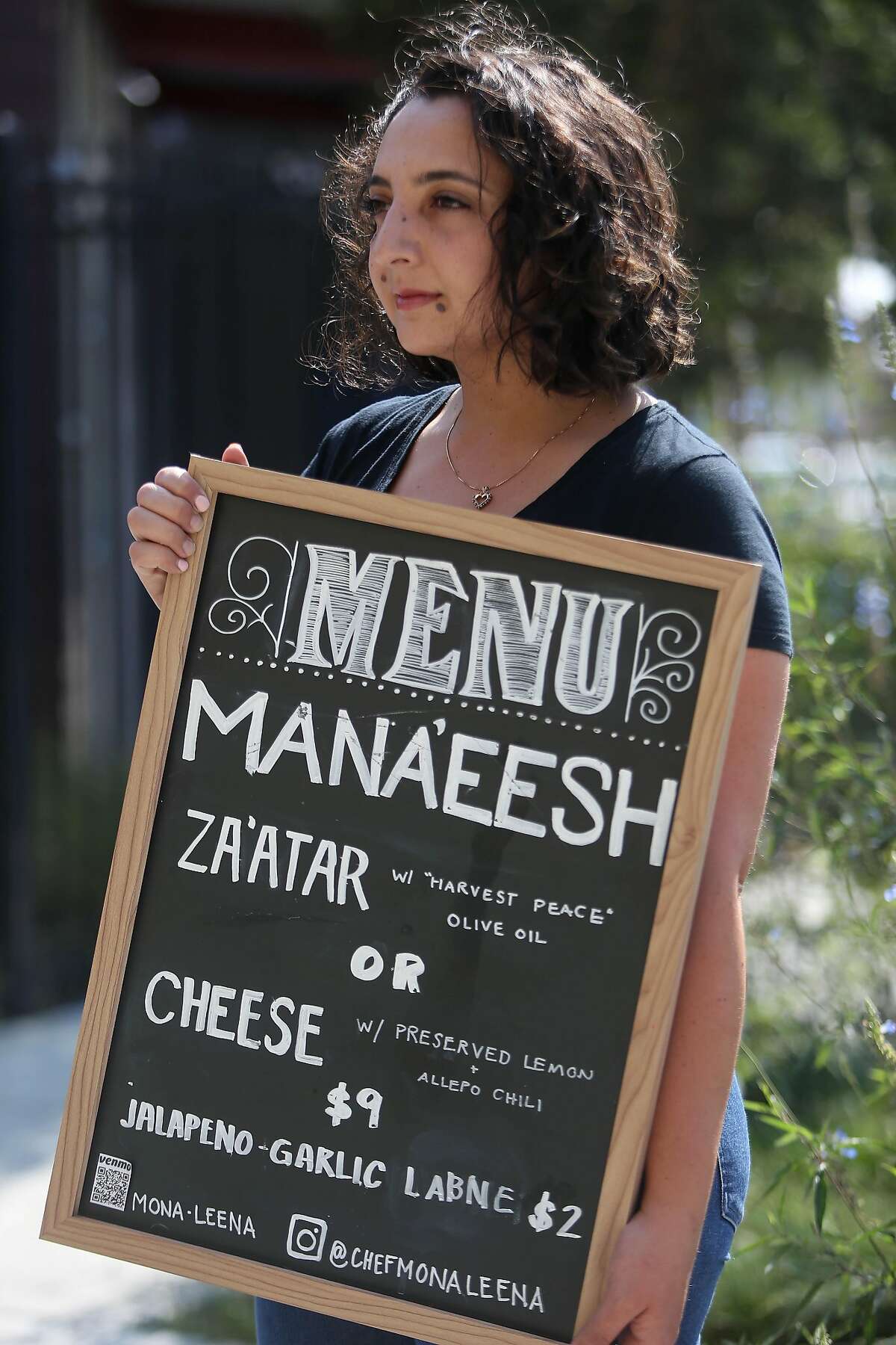 Mona Leena Michael of Oakland stands for a portrait outside the Bakery Lofts on Wednesday, September 16, 2020 in Oakland Calif. Michael, who is a chef, was selling flatbreads and other foods in front of her live/ work space at a pop up in Oakland before the health department shut her down for lack of a permit.