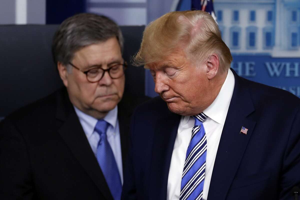 President Trump yields the podium to Attorney General William Barr during a March news conference in Washington.