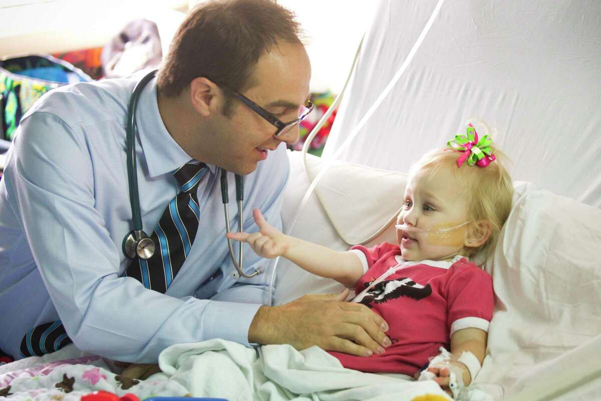 Dr. Brent Mothner checks on Lilly Kilgore, 2at Texas Children's Hospital Thursday, April 11, 2013, in Houston.