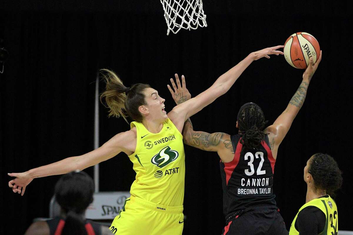 Las Vegas Aces forward Emma Cannon (32) goes up to shoot as Seattle Storm forward Breanna Stewart (30) defends during the second half of Game 2 of basketball's WNBA Finals, Sunday, Oct. 4, 2020, in Bradenton, Fla. (AP Photo/Phelan M. Ebenhack)