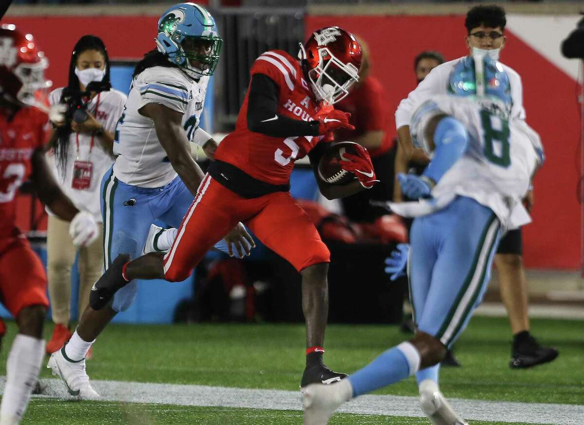 Houston Cougars wide receiver Marquez Stevenson (5) runs the ball during the second quarter of a American Athletic Conference game against the Tulane Green Wave Thursday, Oct. 8, 2020, at TDECU Stadium in Houston.