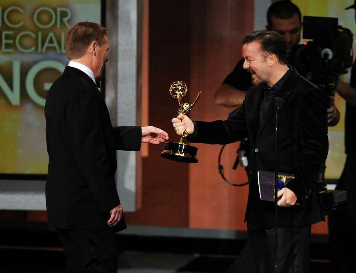 Wilton resident Bucky Gunts accepts the Outstanding Directing for a Variety, Music, or Comedy Special award from actor Ricky Gervais onstage at the 62nd Annual Primetime Emmy Awards held at the Nokia Theatre L.A. Live on August 29, 2010 in Los Angeles, California.