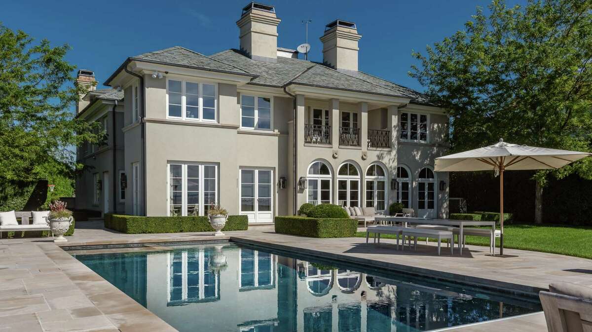 The taupe-colored stucco European chateau at 62 Bermuda Road has direct waterfront on Long Island Sound and a Gunite in-ground swimming pool in the yard. The house was custom-built on a nearly three-quarter acre property in the Saugatuck Shores section of Westport in 2008 by a Westport designer. More recently, this waterfront home underwent an extensive renovation. The combined talents of Architect Marybeth Woods and general contractor George Desmond, created a poetically masterful home to go along with the setting.