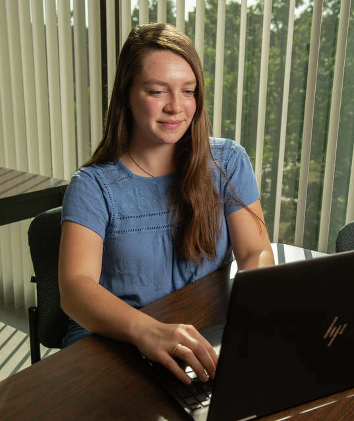 An SIUE student works at her laptop. SIUE’s Graduate School is hosting a series of virtual Open House events in October.