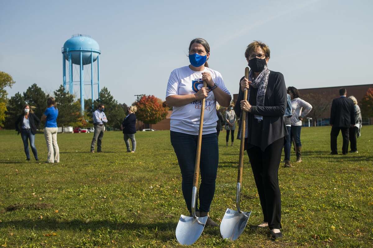 Marcie Post, recreation manager for the City of Midland, left, and Mayor Maureen Donker, right, pose for a photo during a groundbreaking ceremony at the future site of the Miracle Field Friday, Oct. 9, 2020 at Central Park in Midland. (Katy Kildee/kkildee@mdn.net)