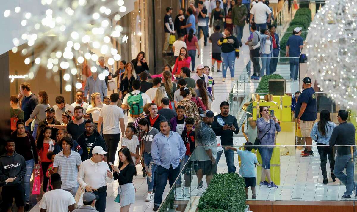 People shop for Black Friday deals at The Galleria mall Friday, Nov. 29, 2019, in Houston. Houstonians will spend about $1,201 per household on average this holiday season, 23 percent less than last year and below the national average of $1,387.