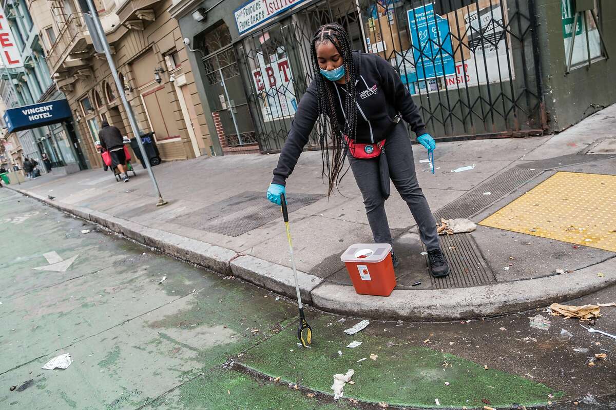 Brittaney Falley, a syringe disposal associate with the San Francisco AIDS Foundation, picks up discarded needles, pipes and other drug paraphernalia in the Tenderloin.