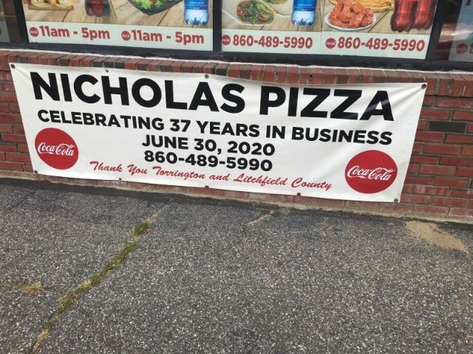 Nicholas Pizza owner Ninoos Yousefdadeh received a zoning violation letter this week from the Torrington land use office, saying his signs are not allowed without a permit. Photo: Nicholas Pizza / Contributed Photo