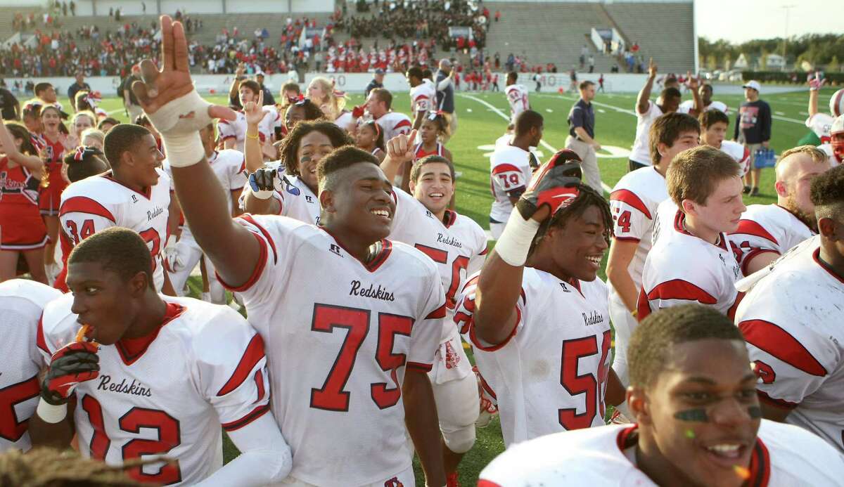 Jonathan Beaudion (75) and the Lamar High School footbal team celebrate after beating North Shore High School in a 5A Division Region III final, Saturday, Dec. 8, 2012, in Veterans Memorial Stadium in Pasadena. ( Nick de la Torre / Houston Chronicle )