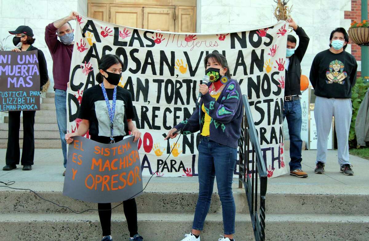 Vanesa Suarez, right, with Justice for Lizzbeth, leads a vigil/protest for Lizzbeth Aleman-Popoca in front of East Haven Town Hall in East Haven, Conn., Friday Oct. 9, 2020. At left is Yaneth Aleman, Lizzbeth’s younger sister. Holding the banner at rear right is Aleman-Popoca’s father, Albino Aleman Sedeño.