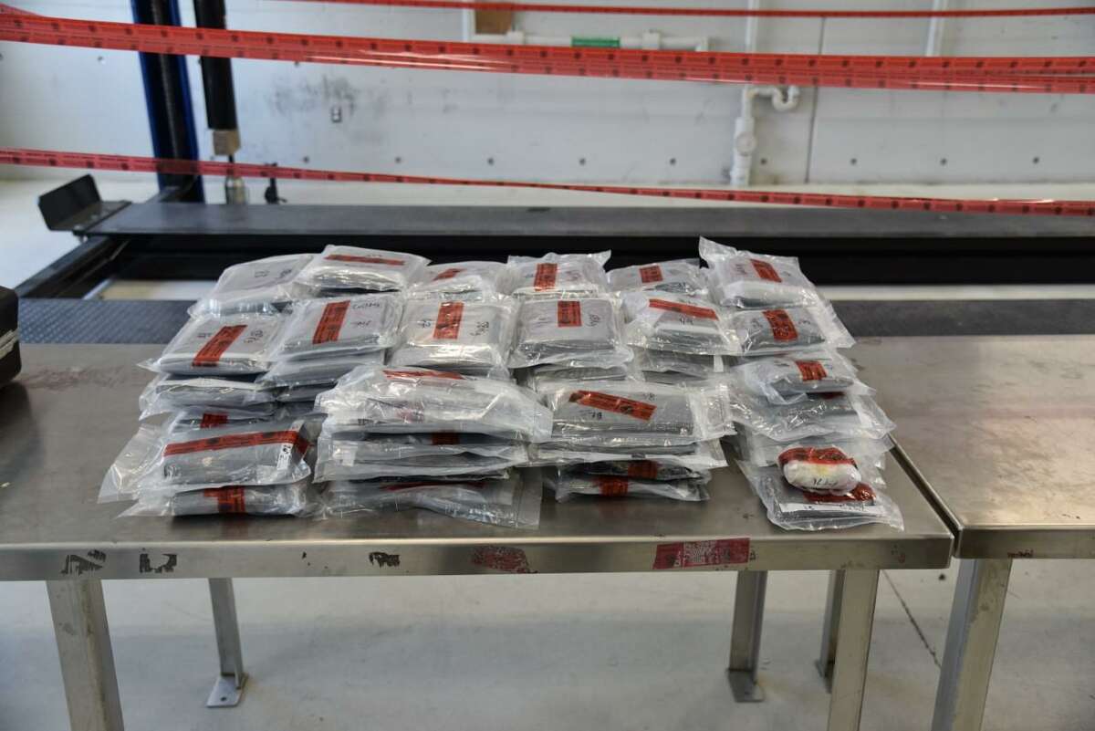 U.S. Customs and Border Protection officers said they seized more than 90 pounds of meth from a woman who claimed she was returning from vacationing in Nuevo Laredo, Mexico. CBP later said that the woman was also transporting about 3 pounds of heroin.