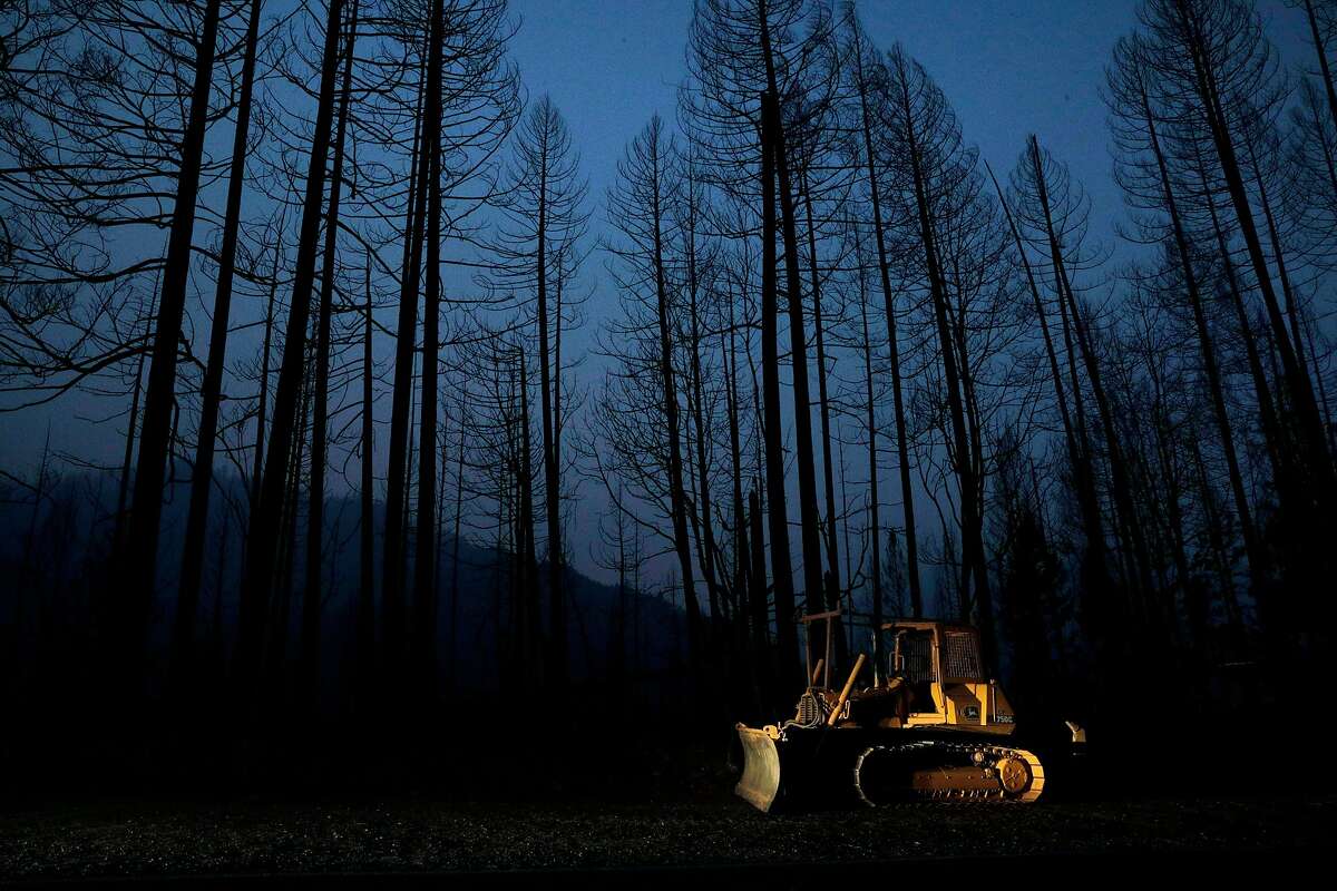 A bulldozer sits amid the ruin left by the Slater Fire in Happy Camp (Siskiyou County). The Kurok Tribe’s traditional burns to control fires in the area were blocked by federal officials.