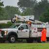 An Entergy employee works in the pouring rain on Phelan Boulevard on Friday afternoon. With Hurricane Delta churning out in the Gulf, Southeast Texans prepare for another possible storm situation. Photo made on October 09, 2020. Fran Ruchalski/The Enterprise