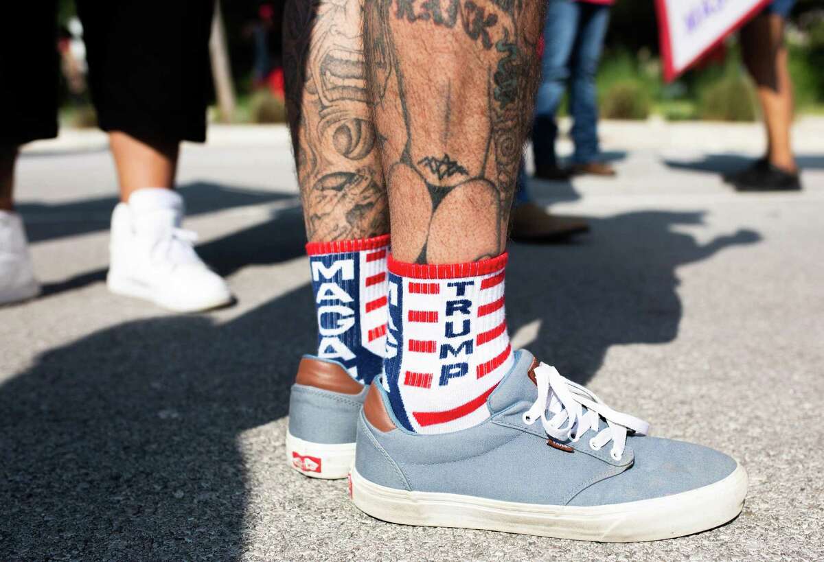 Trump flags, signs and even socks were out in support as people came out to join the protest over their disagreement with Gov. Greg Abbott handling of Covid-19 with mask mandates and business closures and restrictions at the Governor's Mansion on October 10, 2020 in Austin, Texas.