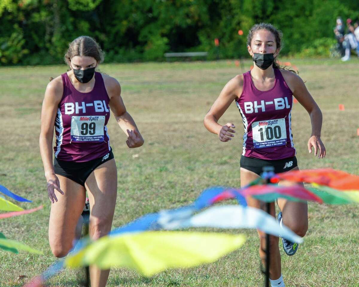 Burnt Hills Ballston Lake runners Jamisen Vendetti and Isabel Vogel cross the finish line in a race against Shaker High School at the Crossings in Colonie, NY, on Saturday, Oct. 10, 2020 (Jim Franco, special to the Times Union.)