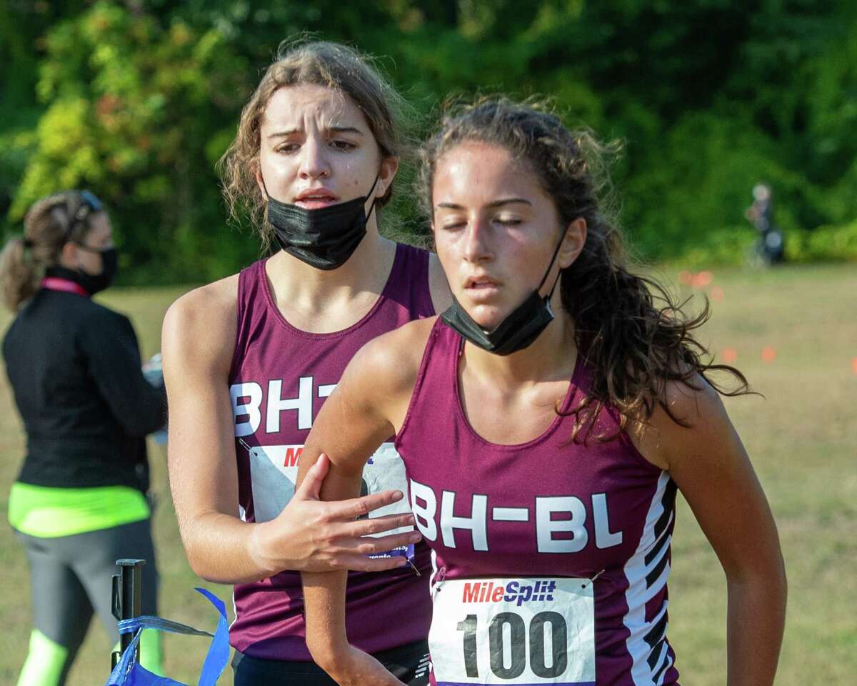 Burnt Hills Ballston Lake runners Jamisen Vendetti and Isabel Vogel cross the finish line in a race against Shaker High School at the Crossings in Colonie, NY, on Saturday, Oct. 10, 2020 (Jim Franco, special to the Times Union.)