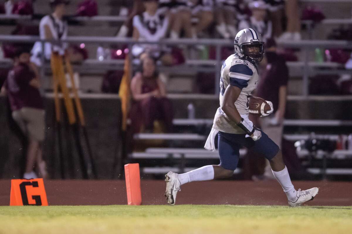 Mustangs Jamaal Shaw (25) crosses the goal line for a touchdown. The Mustangs of West Orange-Stark traveled to Silsbee High School to take on the Tigers on Saturday night. Photo made on October 10, 2020. Fran Ruchalski/The Enterprise