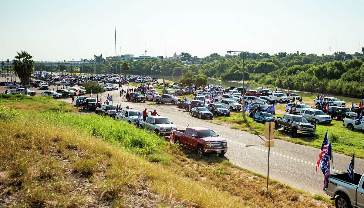 Supporters of President Trump gather at the banks of the Rio Grande, Saturday, Oct. 10, 2020, before departing for the second Trump Train through Laredo.