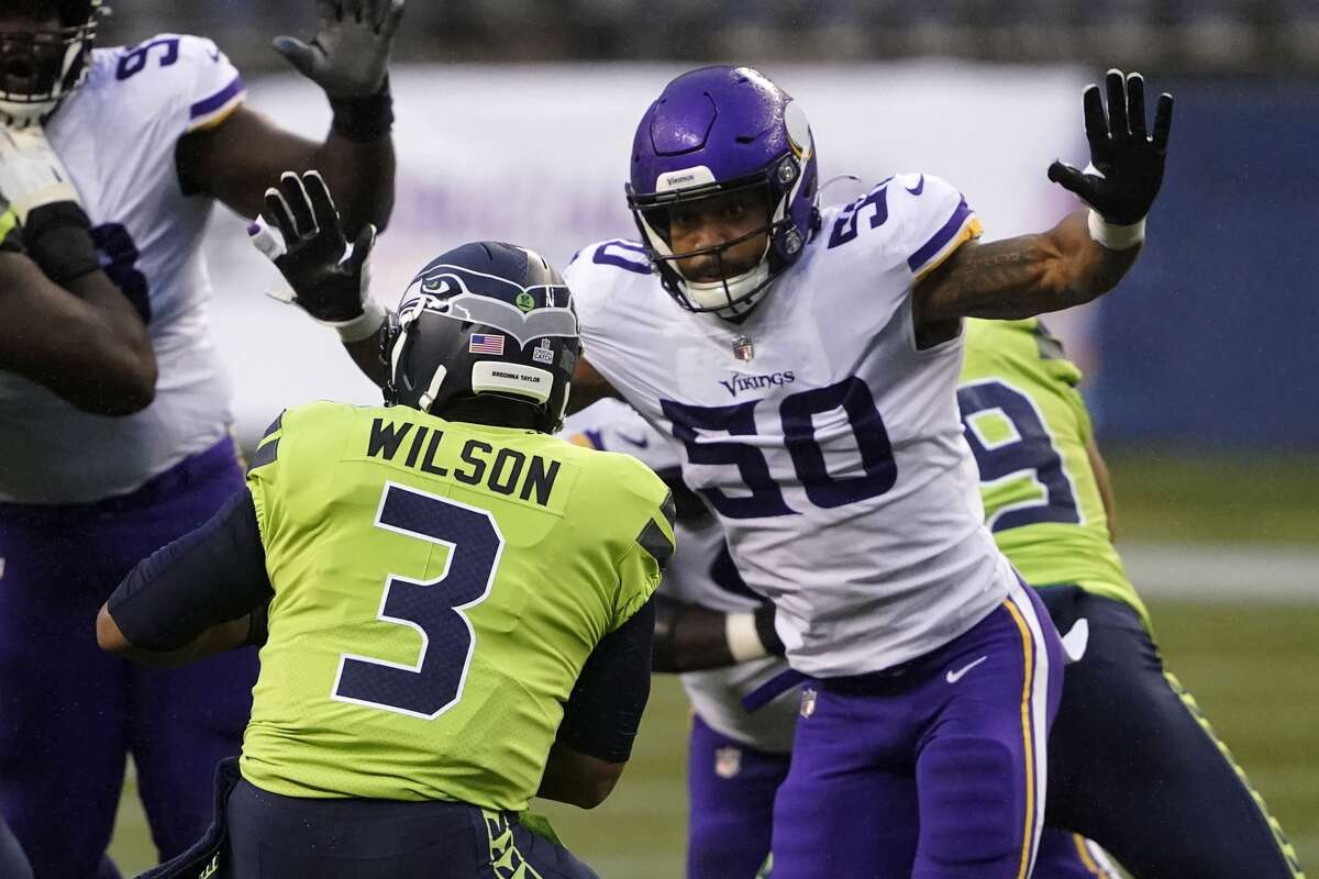 Minnesota Vikings outside linebacker Eric Wilson rushes toward Seattle Seahawks quarterback Russell Wilson before sacking him during the first half of an NFL football game, Sunday, Oct. 11, 2020, in Seattle. (AP Photo/Ted S. Warren)
