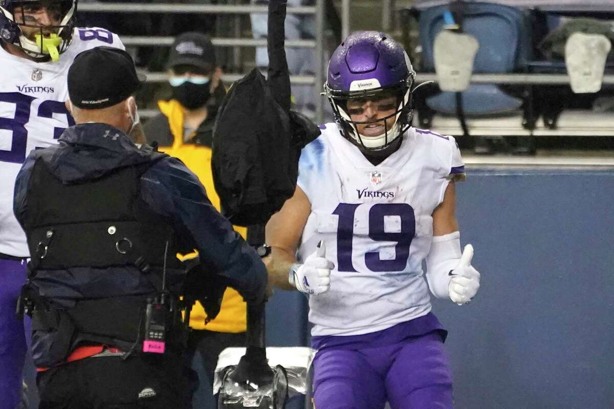 Minnesota Vikings wide receiver Adam Thielen mugs for a camera after scoring a touchdown against the Seattle Seahawks during the second half of an NFL football game, Sunday, Oct. 11, 2020, in Seattle.