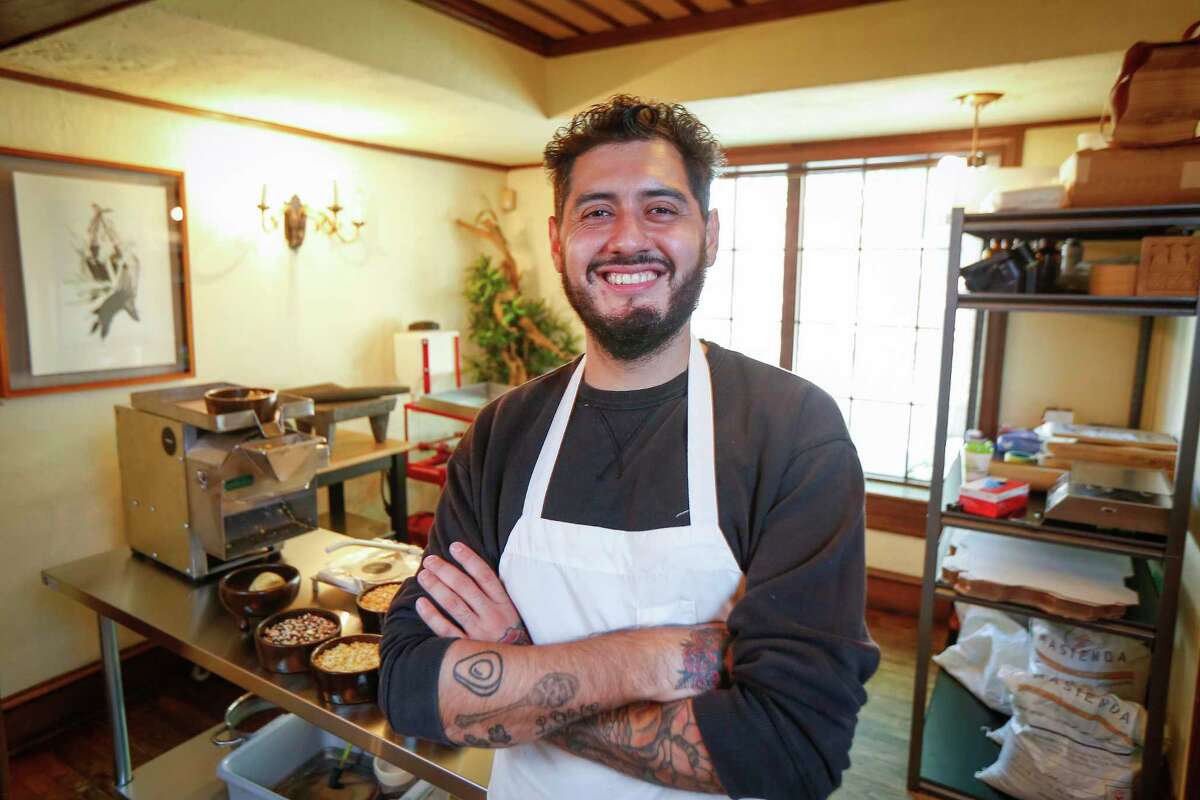 Emmanuel Chavez makes masa and tortillas with heirloom Mexican corn out of their Houston tortilleria, Tatemo, Tuesday, Sept. 29, 2020, in Houston.