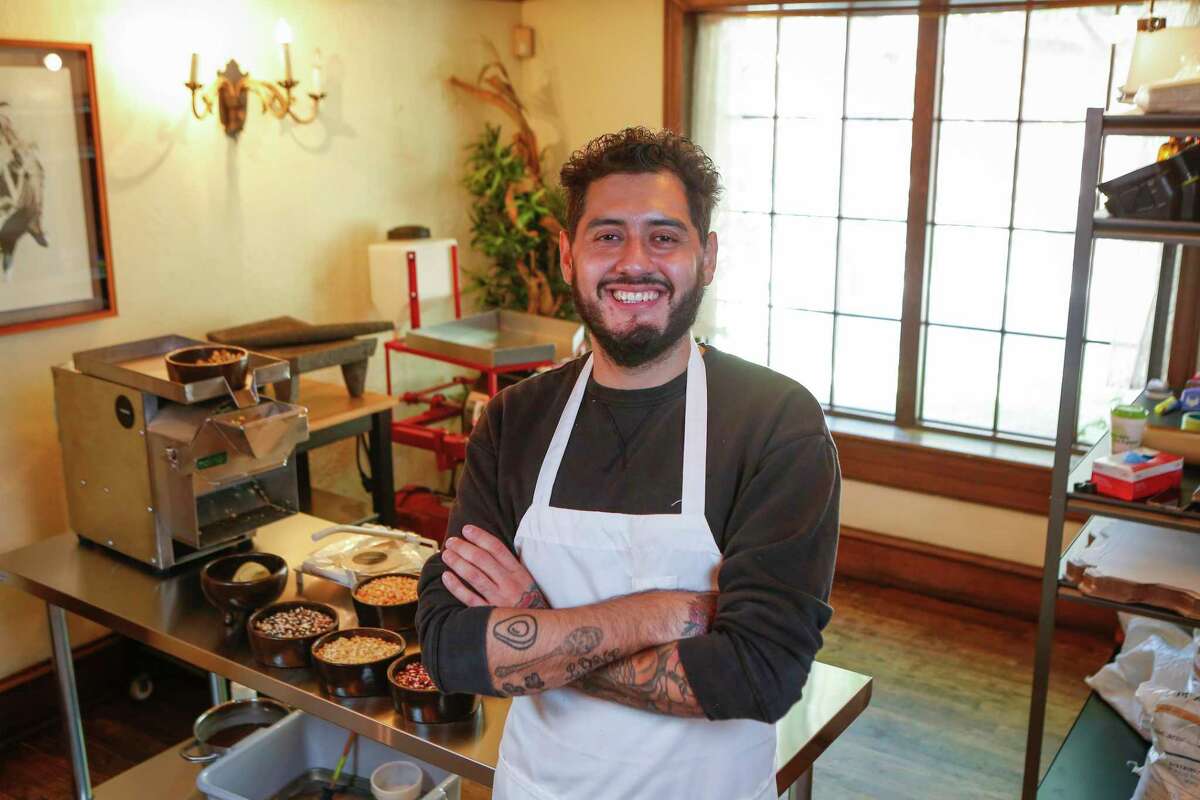 Emmanuel Chavez makes masa and tortillas with heirloom Mexican corn out of their Houston tortilleria, Tatemo, Tuesday, Sept. 29, 2020, in Houston.