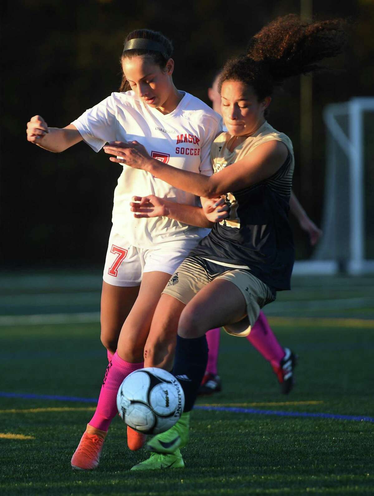 Masuk's Amanda Campos, left, and Notre Dame of Fairfield's Toni Domingos battle for the ball during their 0-0 tie SWC girls soccer match in Fairfield, Conn. on Monday, October 28, 2019.