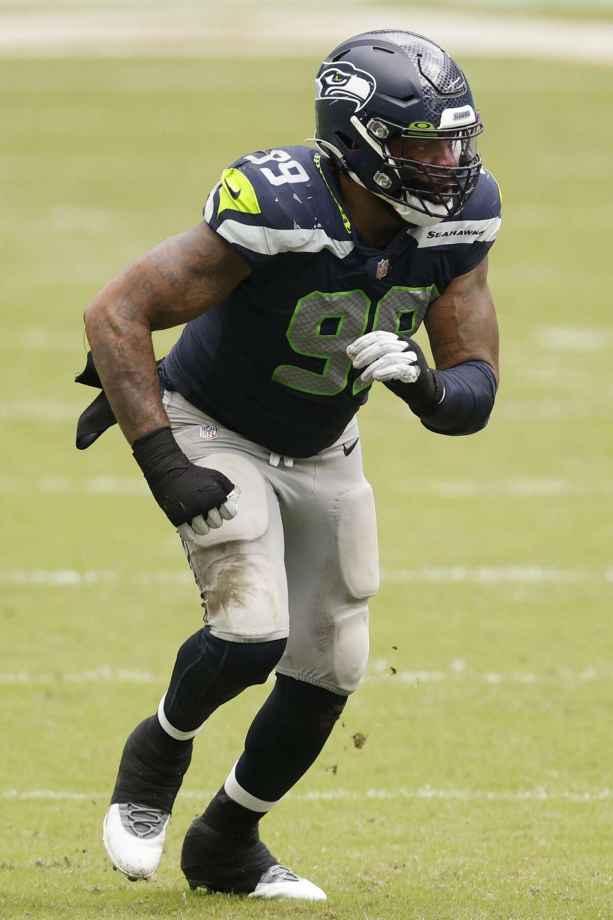 MIAMI GARDENS, FLORIDA - OCTOBER 04: Damontre Moore #99 of the Seattle Seahawks in action against the Miami Dolphins during the second half at Hard Rock Stadium on October 04, 2020 in Miami Gardens, Florida. (Photo by Michael Reaves/Getty Images)