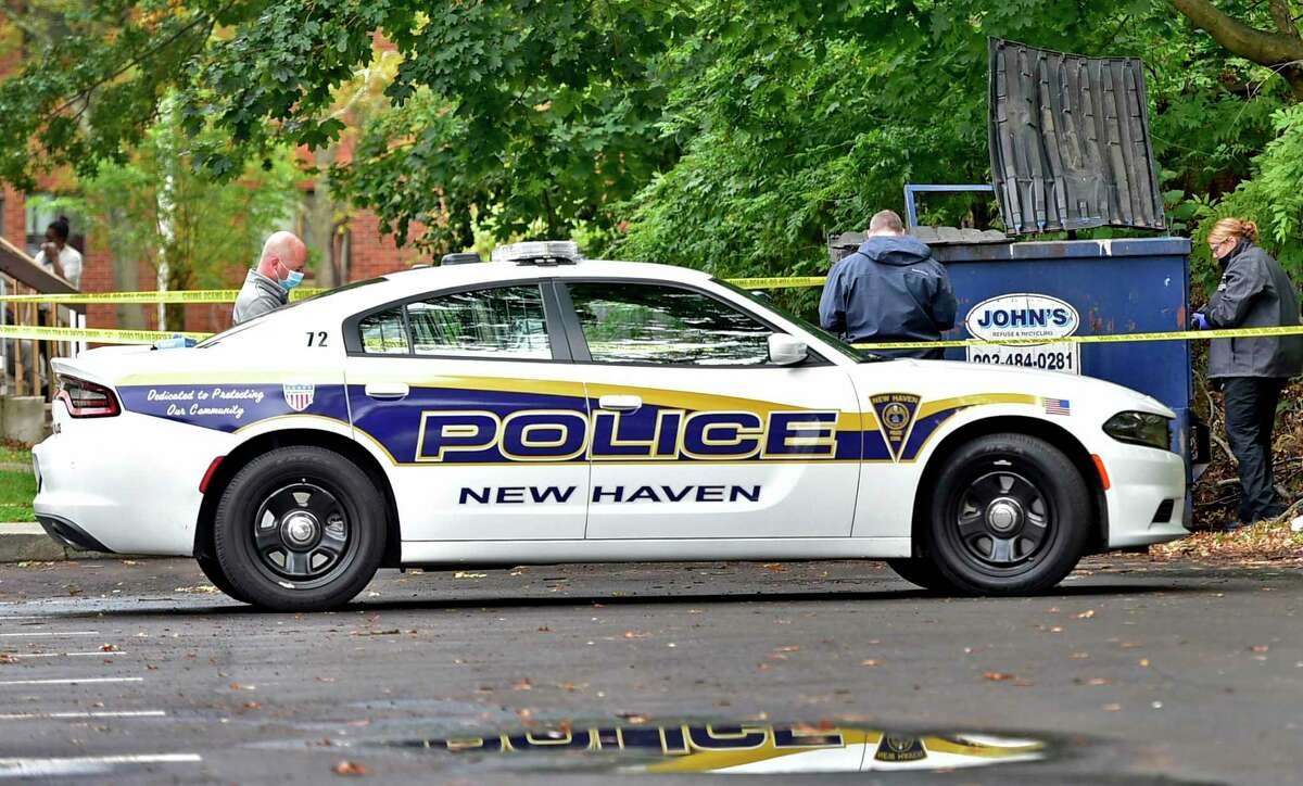 New Haven, Connecticut - Friday, October 12, 2020: New Haven Police investigate the scene where a baby girl, 8-months, was found alive in a dumpster outside an apartment complex Monday at 575 Dixwell Ave in New Haven.