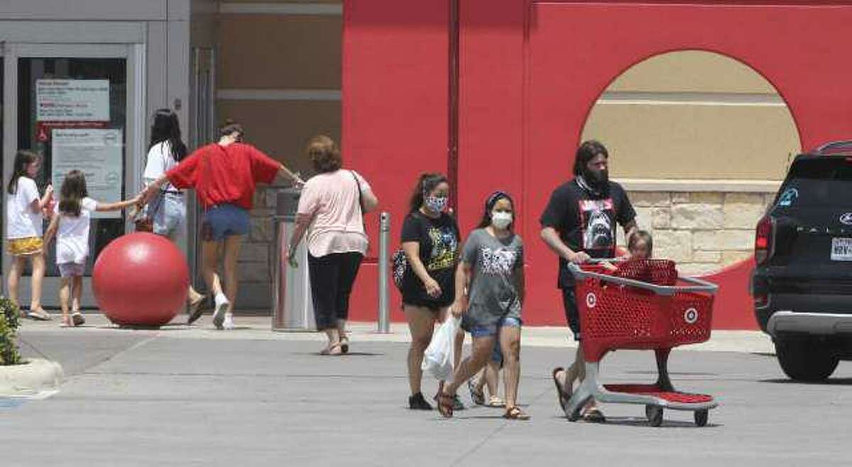Shoppers come and go from a Target in New Braunfels in July. Target reported a huge jump in curbside pickups of orders.