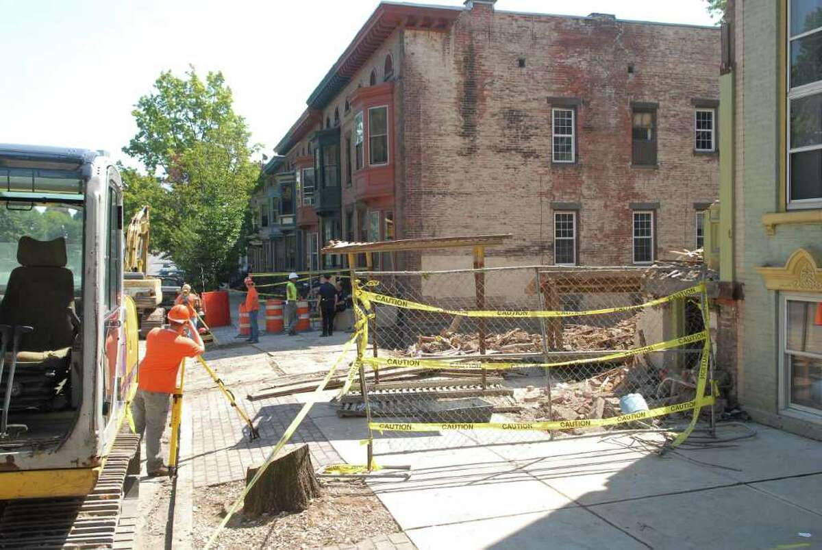 Emergency personnel and construction crews man the scene of 600 Madison Avenue in Albany, NY on Monday, Aug. 30, 2010. (Paul Buckowski / Times Union)