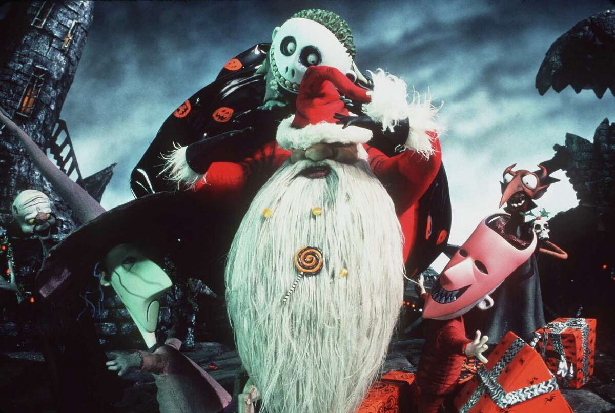 Lock, right, Shock, left, and Barrel, center, return triumphantly to Halloweentown with "Sandy Claws" in order that Jack Skellington can take his place in Touchstone Pictures animated film, "Tim Burton's A Nightmare Before Christmas. (Joel Fletcher/Online USA/Hulton Archive/Getty Images/TNS)