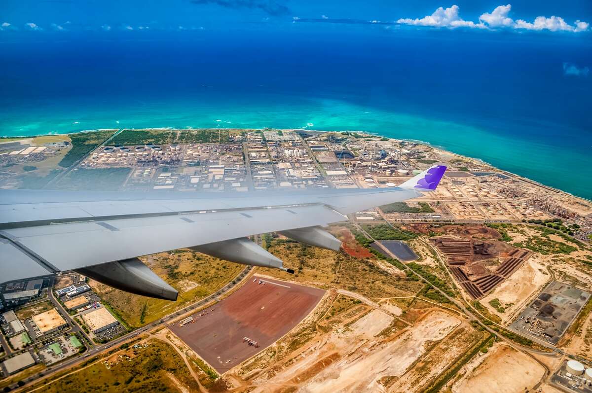 A Hawaiian Airlines jet on approach to Honolulu International Airport. On Oct. 15 2020, Hawaii re-opens to tourists who test negative for COVID-19