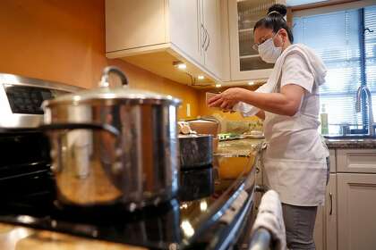 Home kitchen entrepreneur Cheska Kistner makes food at her home in Benicia, Calif., on Monday, October 12, 2020. Kistner is among an estimated 100 entrepreneurs waiting for Solano County to finish implementing a law that would allow them to establish legal home kitchen businesses.