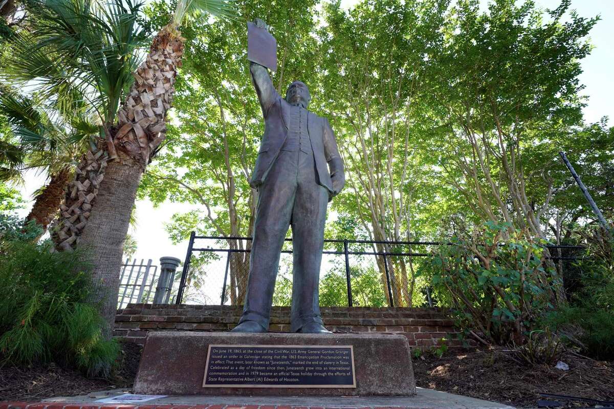 A statue in Galveston depicts a man holding the state law that made Juneteenth a holiday. As recently as 2010, textbooks in Texas left out slavery as a central cause of the Civil War.