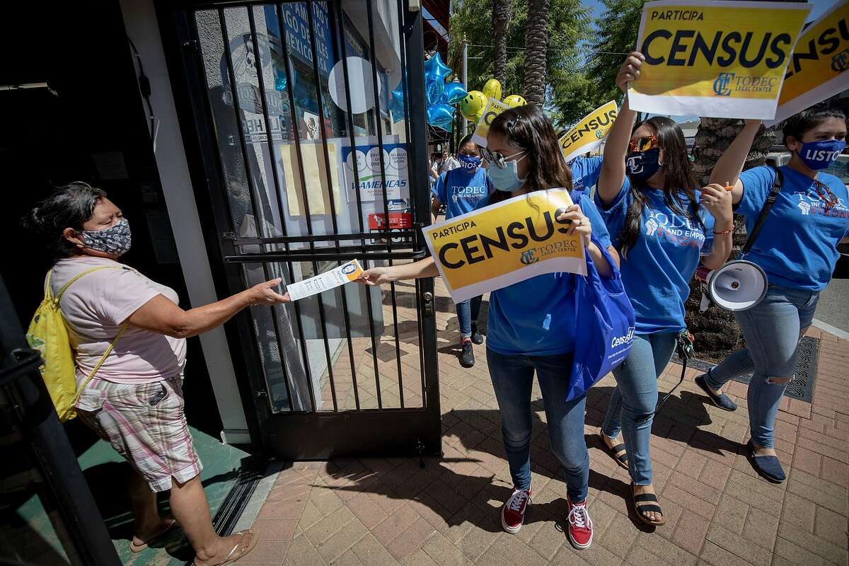 Volunteers hand out census information pamphlets in Perris, Calif., last August.