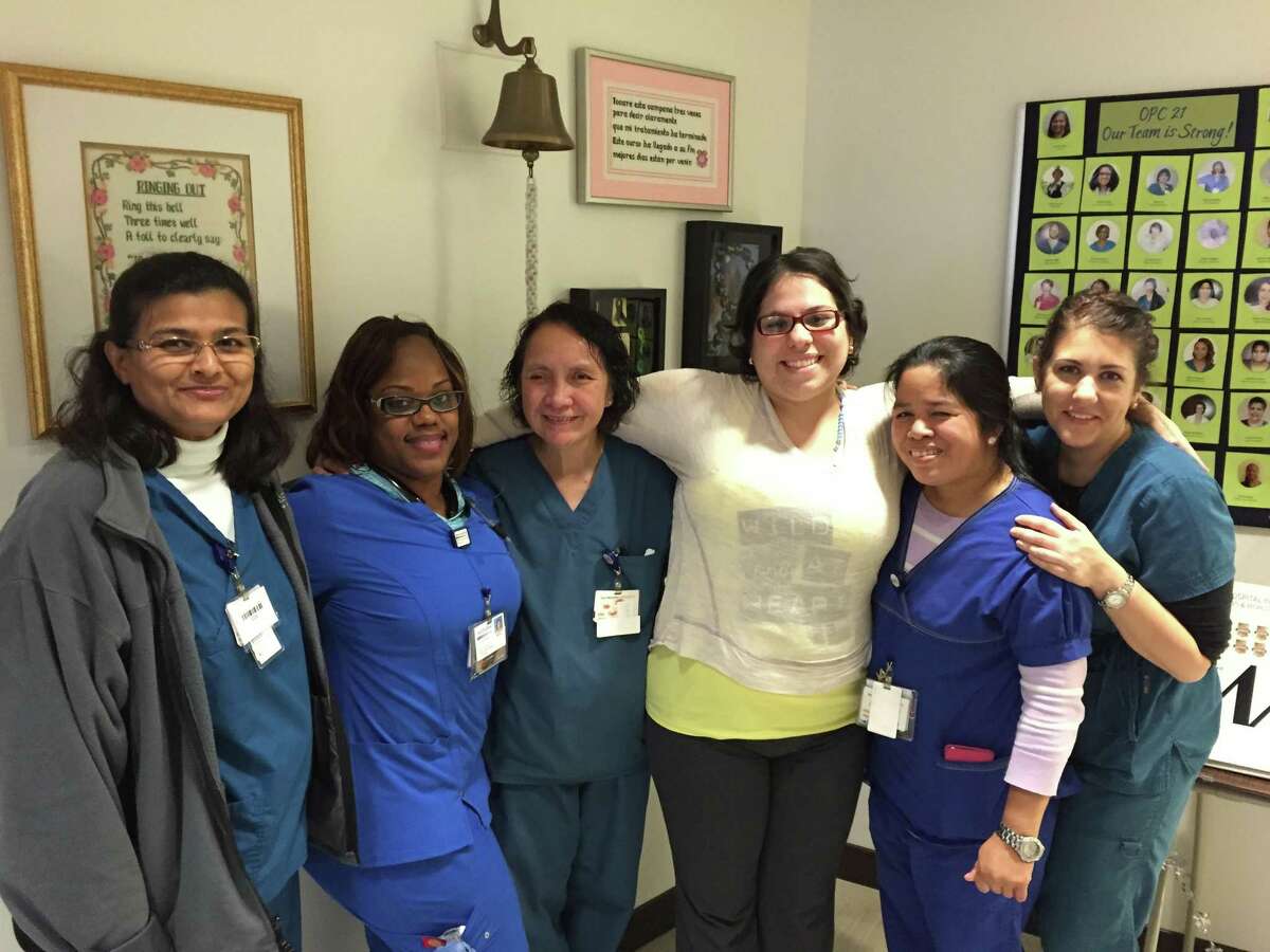 Ediana Quijada takes a moment with some of the nurses who helped care for her.