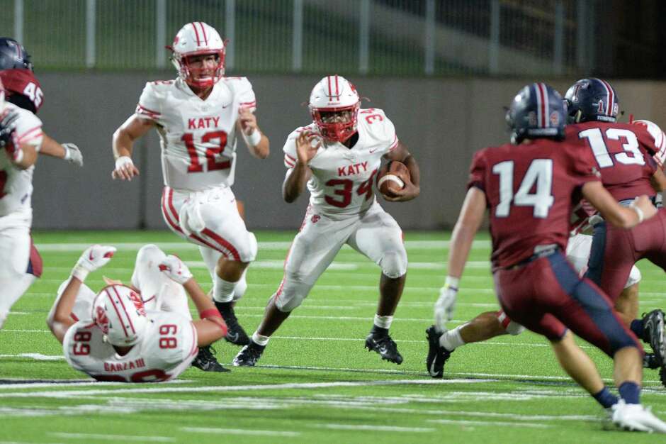 Ron Hoff (34) of Katy carries the ball during the fourth quarter of a 6A Region III District 19 football game between the Katy Tigers and the Tompkins Falcons on Thursday, October 3, 2019 at Legacy Stadium, Katy, TX.