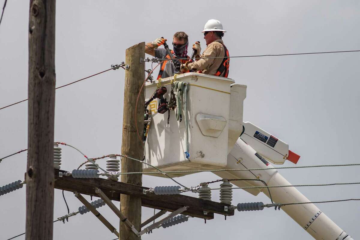 In spite of the heat advisory, electrical linemen are working countless hours all over Southeast Texas to get the power back on, like these men working near the Port Neches city limits along FM 366 on Tuesday afternoon. Photo made on September 1, 2020. Fran Ruchalski/The Enterprise