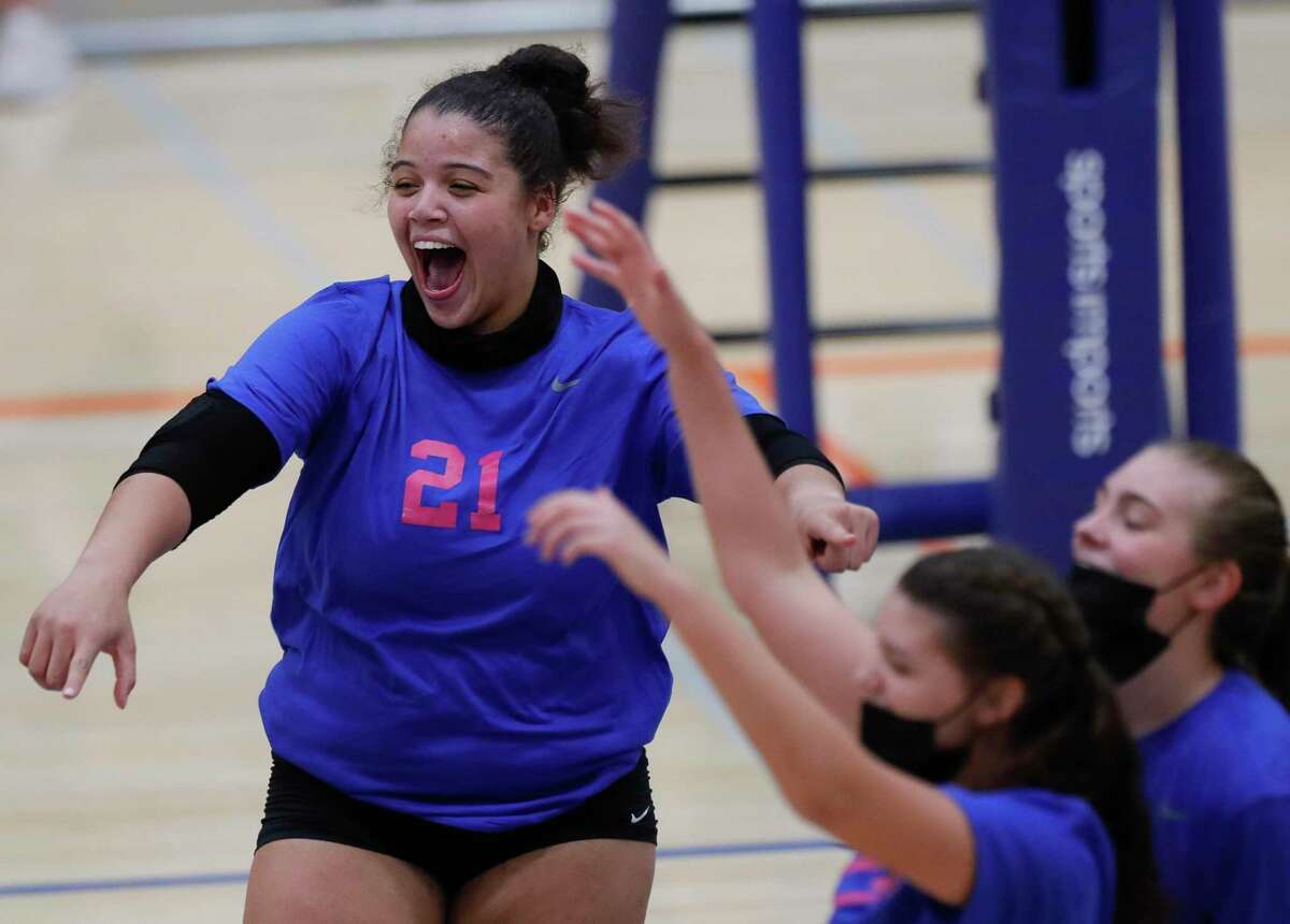 Grand Oaks outside hitter Fallon Thompson (21) reacts after scoring a point during the third set of a District 13-6A high school volleyball match at Grand Oaks High School, Tuesday, Oct. 13, 2020, in Spring. Grand Oaks swept College Park in straight sets.